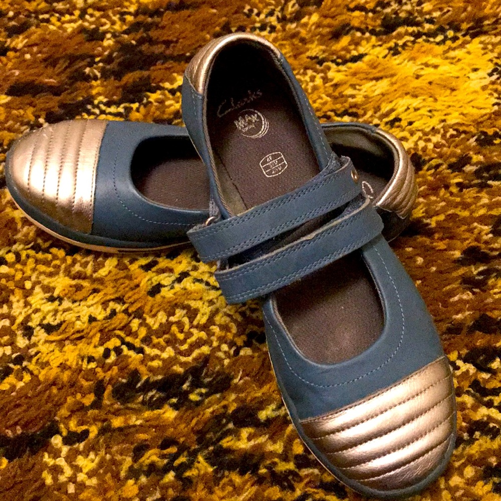 Blue and silver strapped flats